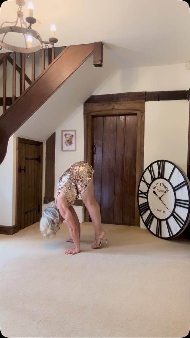 Handstand in heels 👠 Props to this dress for hanging on for dear life during this float 😂 The dress was more of a hazard than the heels this time👠 #handstandinheels #highheels #stiletto #sequins #gold #golddress #handstand #legs #airwalk #float #alldressedup #minidress by @emma_buchy