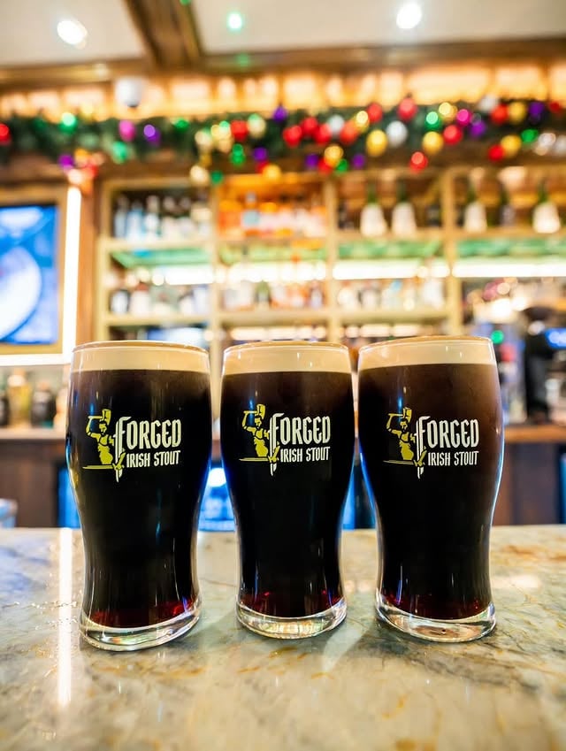 Forged, Not Poured! @forgedirishstout 👑 Three crowns of darknessstand at attention.Barroom lights bow.The foam holds its nerve.This isn’t a drink—it’s pressurelearning patience.Steel in liquid form.Victory, slowly settling.SPLIT THE STEEL! ⚔️ @forgedirishstout