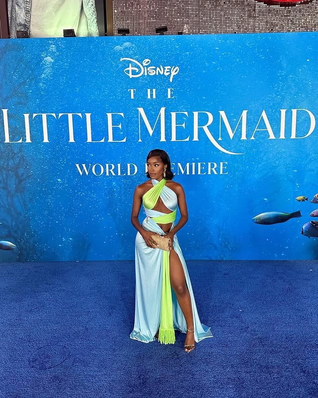 PINCH MEEEE! 😭 Attended my first ever red carpet movie premiere and it was for The Little Mermaid live action film! If you’ve been following me, you know I’ve been speaking about wanting to attend movie premieres this year and enter a new level in my career. I said “idk how I’m going to get to this premiere, but I WILL” 😂. I manifested this and I just have to thank God. I witnessed history last night. Halle and the rest of the cast were so amazing! My heart was so full watching the film. Our little mermaid is gorgeous, and she looks just like me 🥺🫶🏾 Check out the film in theaters on May 26! Last photo is my mood after watching!! #disney #thelittlemermaid •Fashion Styling by @thefvshionjuice Hair @certified_stylez_ Dress & Earrings @revolve x @bronxandbanco (linked in bio) Heels @tonybianco Clutch @amazon by @angwitacho