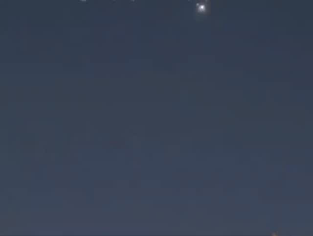 Air defense activity seen over Bahrain’s capital of Manama during tonight’s retaliatory ballistic missile attack by Iran.