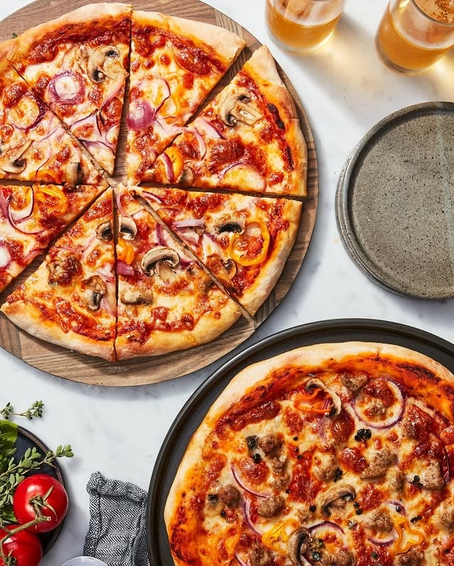 THE pizza on our Top 10 recipe list of all time: Sourdough Discard Pizza! Get it at the link in our profile >> @kingarthurbaking and kick off the #SummerOfPizza with a bang! by @kingarthurbaking
