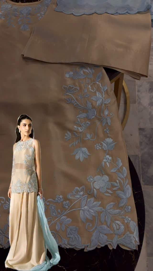 This stunning skin beige ensemble is beautifully adorned with intricate feroza resham embroidery, enhanced with exquisite cutwork detailing and a captivating 3D border finish. Paired with perfectly tailored matching plazo pants and complemented by a luxurious contrast silk dupatta, this outfit creates a graceful statement for festive gatherings and special occasions.A timeless blend of sophistication and artistry, designed to leave a lasting impression.#SFSadiaFaisalOfficial #LuxuryPret #FestiveEdit #ReshamWork #CutworkDetails 3DDesi by @sf_sadiafaisalofficial
